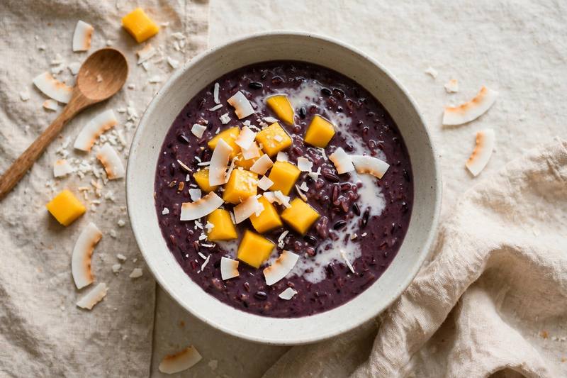 Photo of Black Rice Porridge with Coconut and Mango, a breakfast recipe from FluentFuel