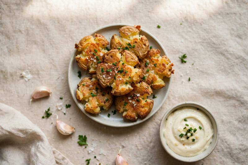 Photo of Crispy Smashed Potatoes with Garlic Aioli, a snack recipe from FluentFuel
